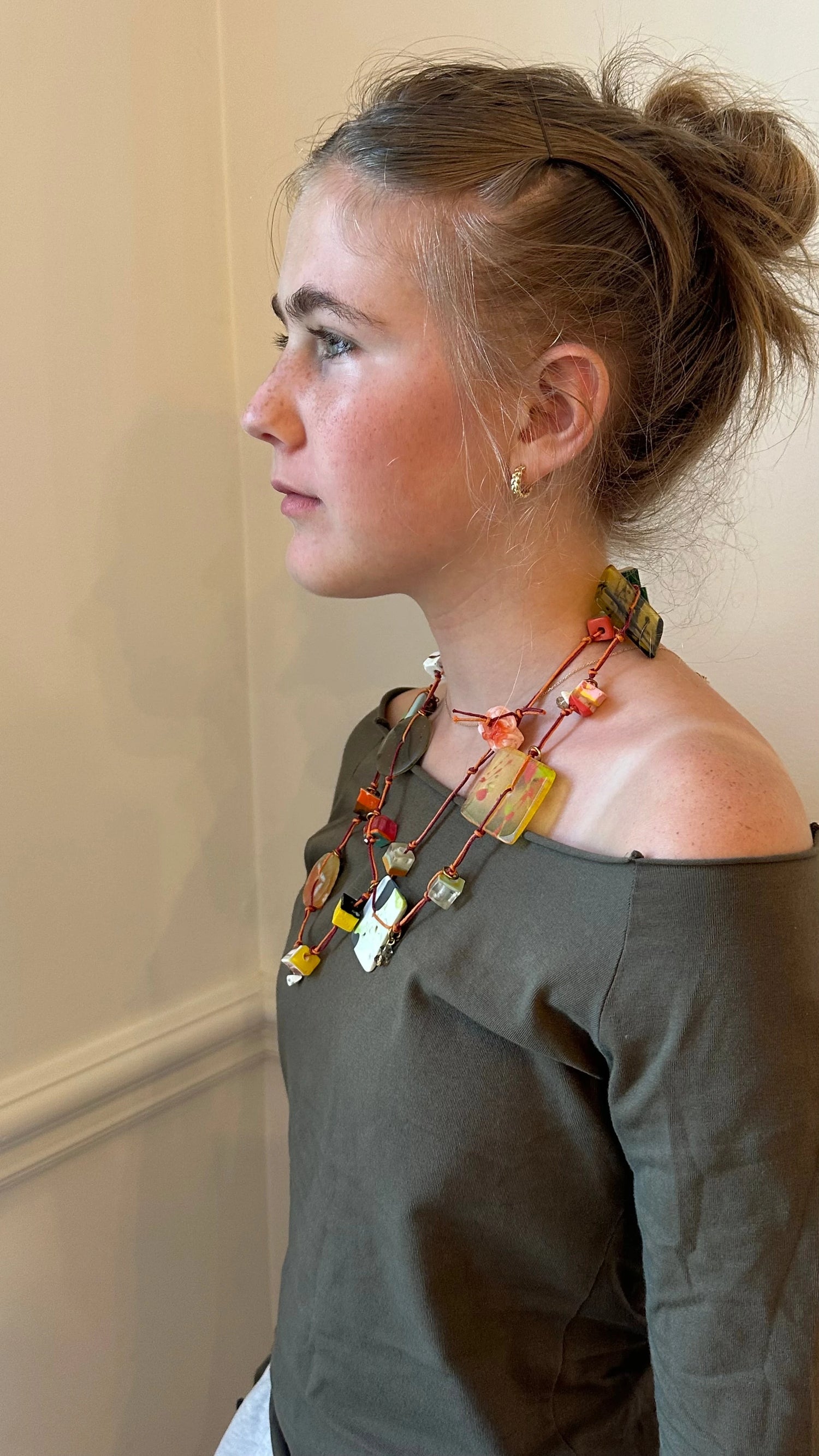 The String Collection features delicate Resin beads which are handstrung onto cotton and embelished with charms fashioned from semi precious stones.  Strung by hand each necklace is unique as no two beads are alike.  